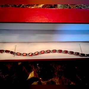 Garnet and 92.5% pure sterling silver tennis bracelet